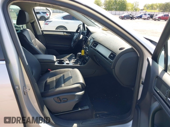 2014 Volkswagen Touareg Sport with VIN WVGEF9BP6ED007436, listed as a IAAI auction lot 41953307 with 114,925 mi miles and . Bid and sale history available at DreamBid. Image 5.