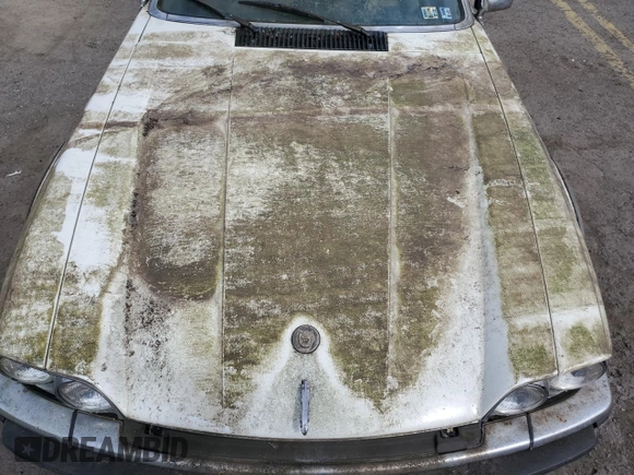 1989 Jaguar XJS z VIN SAJNY584XKC161154, wystawiony jako Copart lot #70912984 z przebiegiem 65 188 mil mil oraz Czysty tytuł • Clean title. Historia ofert i sprzedaży dostępna na DreamBid. Obrazek 11.