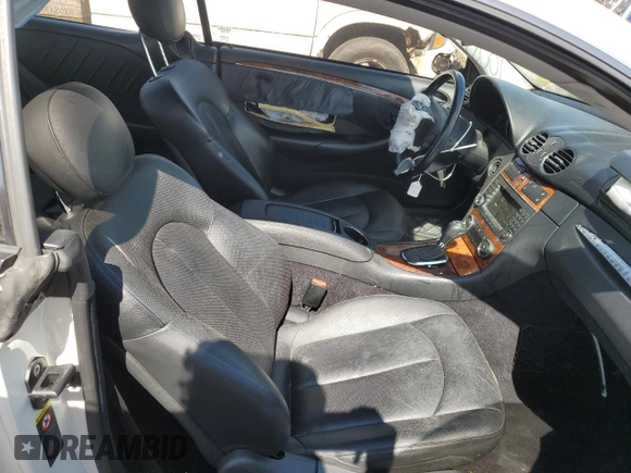 2009 Mercedes-Benz CLK-Class 3.5L with VIN WDBTJ56H09F261819, listed as a Copart auction lot 70021184 with 130,976 mi miles and Salvage Title. Bid and sale history available at carsss.com. Image 7.