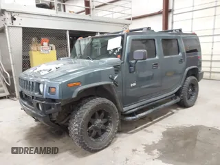 2005 Hummer H2 SUV with VIN 5GRGN23U65H132505, listed as a IAAI auction lot 41515346 with 140,944 mi miles. Bid and sale history available at carsss.com. Image 2.