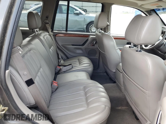 1999 Jeep Grand Cherokee Limited with VIN 1J4GW68S6XC713297, listed as a Copart auction lot 55264384 with 98,912 mi miles and Salvage Title. Bid and sale history available at carsss.com. Image 11.