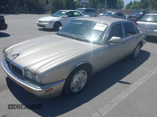 1997 Jaguar XJ with VIN SAJHX1243VC811674, listed as a IAAI auction lot 42333801 with 213,248 mi miles and . Bid and sale history available at DreamBid. Image 6.