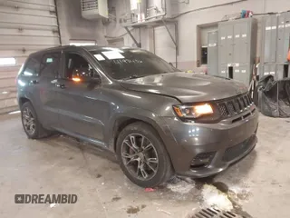 2018 Jeep Grand Cherokee SRT z VIN 1C4RJFDJ6JC432683, wystawiony jako IAAI lot #41971436 z przebiegiem 113 078 mil mil oraz . Historia ofert i sprzedaży dostępna na DreamBid. Obrazek 1.
