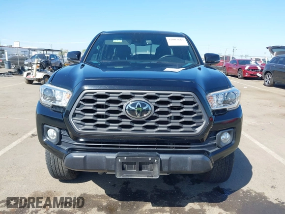 2021 Toyota Tacoma SR z VIN 3TMCZ5AN3MM421868, wystawiony jako IAAI lot #42003665 z przebiegiem 39 380 mil mil oraz . Historia ofert i sprzedaży dostępna na DreamBid. Obrazek 12.