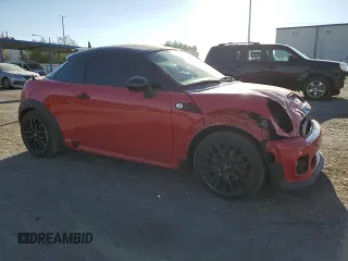 2015 MINI Coupe S z VIN WMWSX3C59FT409468, wystawiony jako Copart lot #71401384 z przebiegiem Nie podano mil oraz Szkody całkowita. Historia ofert i sprzedaży dostępna na DreamBid. Obrazek 4.