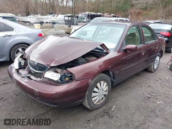 2000 Mercury Mystique GS z VIN 1MEFM6533YK613961, wystawiony jako IAAI lot #41982995 z przebiegiem 83 174 mil mil oraz . Historia ofert i sprzedaży dostępna na DreamBid. Obrazek 2.