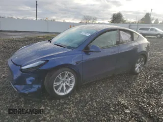 2023 Tesla Model Y Long Range z VIN 7SAYGAEE7PF824973, wystawiony jako Copart lot #85136974 z przebiegiem 11 984 mil mil oraz Szkody całkowita. Historia ofert i sprzedaży dostępna na DreamBid. Obrazek 1.