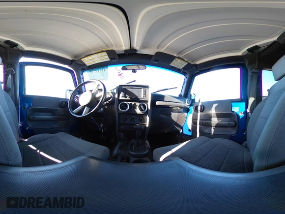 2009 Jeep Wrangler Sahara z VIN 1J4FA54199L722192, wystawiony jako IAAI lot #41619305 z przebiegiem 105 545 mil mil oraz . Historia ofert i sprzedaży dostępna na DreamBid. Obrazek 21.