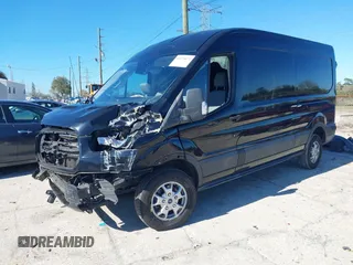2016 Ford Transit Cargo z VIN 1FTYR2CM6GKB54374, wystawiony jako IAAI lot #41674672 z przebiegiem 128 594 mil mil oraz . Historia ofert i sprzedaży dostępna na DreamBid. Obrazek 2.