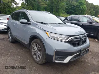 2020 Honda CR-V Touring z VIN 2HKRW2H90LH679005, wystawiony jako IAAI lot #42500586 z przebiegiem 37 640 mil mil oraz . Historia ofert i sprzedaży dostępna na DreamBid. Obrazek 1.