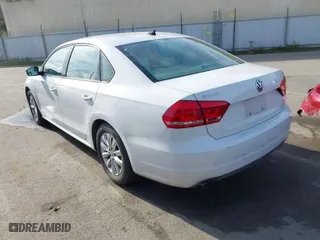 2014 Volkswagen Passat Wolfsburg Ed with VIN 1VWAT7A30EC097331, listed as a IAAI auction lot 41762061 with 173,351 mi miles. Bid and sale history available at carsss.com. Image 3.
