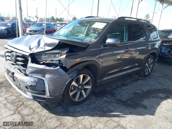 2025 Honda Pilot Touring with VIN 5FNYG2H73SB004351, listed as a IAAI auction lot 41699830 with 6,377 mi miles. Bid and sale history available at carsss.com. Image 2.