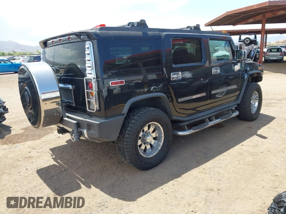 2003 Hummer H2 with VIN 5GRGN23U73H122756, listed as a IAAI auction lot 42194176 with 239,411 mi miles. Bid and sale history available at carsss.com. Image 4.