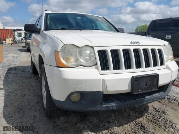 2010 Jeep Grand Cherokee Laredo with VIN 1J4PR4GK0AC151711, listed as a IAAI auction lot 41940295 with 185,684 mi miles. Bid and sale history available at carsss.com. Image 6.