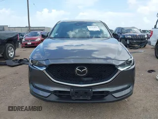 2021 Mazda CX-5 Grand Touring with VIN JM3KFBDM2M0431484, listed as a IAAI auction lot 42547665 with 34,757 mi miles and . Bid and sale history available at DreamBid. Image 13.