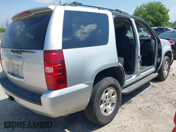 2013 Chevrolet Tahoe LS with VIN 1GNSCAE08DR153829, listed as a IAAI auction lot 42742266 with 216,821 mi miles and . Bid and sale history available at DreamBid. Image 4.