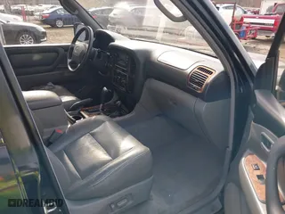 1998 Toyota Land Cruiser with VIN JT3HT05J2W0017214, listed as a IAAI auction lot 41716028 with 214,047 mi miles. Bid and sale history available at carsss.com. Image 5.
