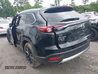 2022 Mazda CX-9 Touring Plus z VIN JM3TCBAY2N0619279, wystawiony jako IAAI lot #42373722 z przebiegiem 43 540 mil mil oraz . Historia ofert i sprzedaży dostępna na DreamBid. Obrazek 3.