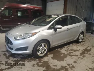 2017 Ford Fiesta SE z VIN 3FADP4BJ0HM144818, wystawiony jako Copart lot #57985525 z przebiegiem 117 049 mil mil oraz Czysty tytuł • Clean title. Historia ofert i sprzedaży dostępna na DreamBid. Obrazek 1.