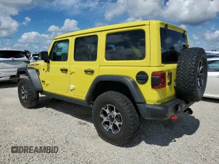 2022 Jeep Wrangler Unlimited Rubicon with VIN 1C4HJXFG3NW214174, listed as a Copart auction lot 74136484 with 5,292 mi miles and Salvage title. Bid and sale history available at DreamBid. Image 2.