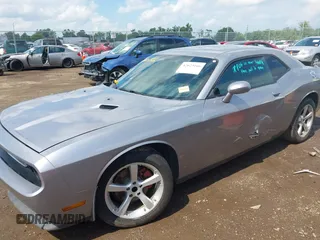 2013 Dodge Challenger SXT с VIN 2C3CDYAG7DH675121, выставлен на аукционе IAAI как лот 42623166 с пробегом 189 604 миль миль и . История ставок и продаж доступна на DreamBid. Изображение 2.