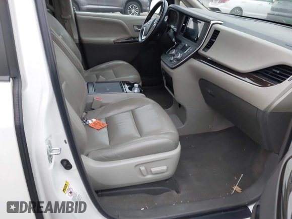 2015 Toyota Sienna XLE with VIN 5TDYK3DC9FS595827, listed as a IAAI auction lot 41014820 with 119,143 mi miles. Bid and sale history available at carsss.com. Image 5.