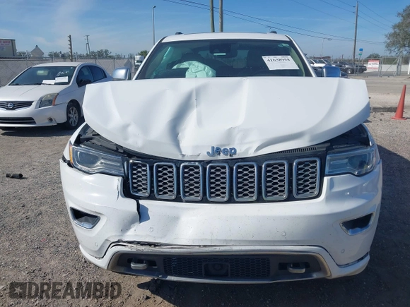 2017 Jeep Grand Cherokee Overland z VIN 1C4RJECG5HC959981, wystawiony jako IAAI lot #41638958 z przebiegiem 102 122 mil mil oraz . Historia ofert i sprzedaży dostępna na DreamBid. Obrazek 12.