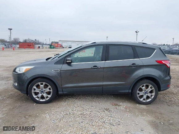2015 Ford Escape Titanium with VIN 1FMCU0JX8FUC33649, listed as a IAAI auction lot 41992427 with 128,757 mi miles. Bid and sale history available at carsss.com. Image 13.