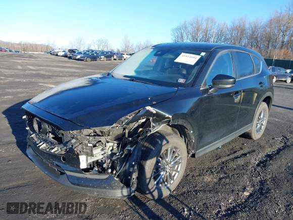 2021 Mazda CX-5 Touring with VIN JM3KFBCM2M1303063, listed as a IAAI auction lot 41814604 with 36,116 mi miles. Bid and sale history available at carsss.com. Image 2.