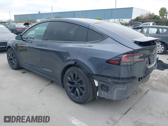 2022 Tesla Model X Plaid with VIN 7SAXCBE6XNF337687, listed as a IAAI auction lot 42035097 with 18,756 mi miles and . Bid and sale history available at DreamBid. Image 3.