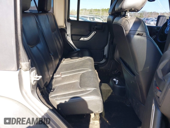 2015 Jeep Wrangler Unlimited Rubicon Hard Rock with VIN 1C4HJWFG2FL587607, listed as a IAAI auction lot 41419237 with 109,719 mi miles and . Bid and sale history available at DreamBid. Image 8.