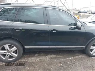 2012 Volkswagen Touareg Sport with VIN WVGFK9BP7CD002243, listed as a IAAI auction lot 41863765 with 136,231 mi miles and . Bid and sale history available at DreamBid. Image 13.
