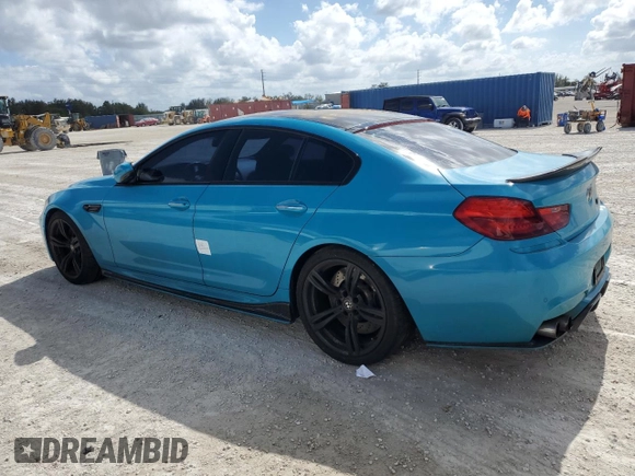 2016 BMW M6 z VIN WBS6E9C51GG437085, wystawiony jako Copart lot #78982124 z przebiegiem Nie podano mil oraz Szkody całkowita. Historia ofert i sprzedaży dostępna na DreamBid. Obrazek 2.