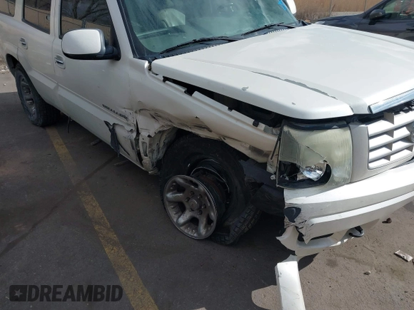 2003 Cadillac Escalade z VIN 1GYEK63N53R304400, wystawiony jako IAAI lot #41544697 z przebiegiem 207 913 mil mil oraz . Historia ofert i sprzedaży dostępna na DreamBid. Obrazek 12.