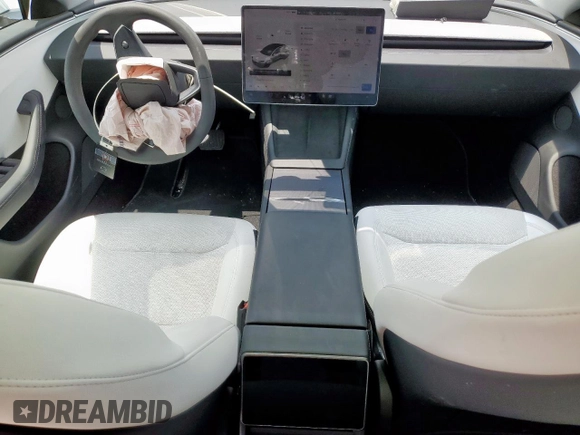 2025 Tesla Model 3 Long Range with VIN 5YJ3E1EB2SF882842, listed as a Copart auction lot 58424635 with 10,817 mi miles and Salvage title. Bid and sale history available at DreamBid. Image 8.