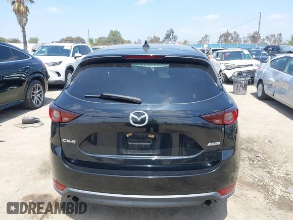 2017 Mazda CX-5 Touring with VIN JM3KFACL0H0124632, listed as a IAAI auction lot 42134971 with 107,029 mi miles and . Bid and sale history available at carsss.com. Image 16.