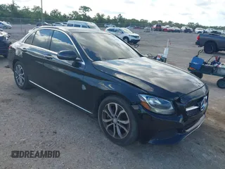 2015 Mercedes-Benz C-Class C 300 with VIN 55SWF4JB7FU053125, listed as a IAAI auction lot 42038080 with 148,553 mi miles. Bid and sale history available at carsss.com. Image 1.