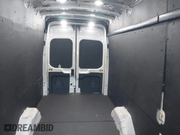 2022 Ford Transit Cargo with VIN 1FTBW3X80NKA69156, listed as a IAAI auction lot 42059236 with 100,096 mi miles and . Bid and sale history available at DreamBid. Image 8.