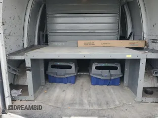 2014 Chevrolet Express Cargo with VIN 1GCWGFCA8E1121812, listed as a IAAI auction lot 42801147 with 128,506 mi miles and . Bid and sale history available at DreamBid. Image 2.