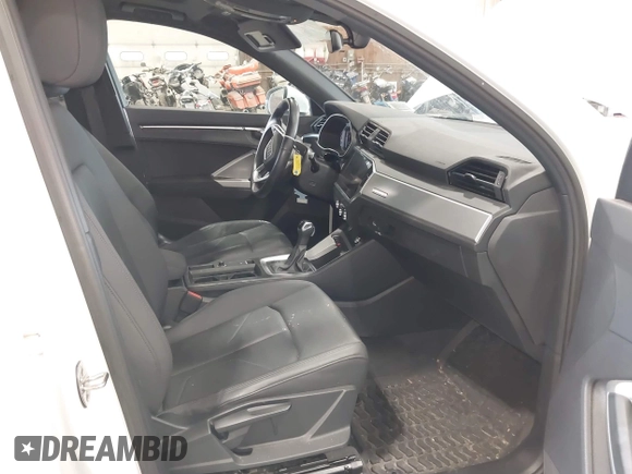 2020 Audi Q3 Premium with VIN WA1AECF3XL1090825, listed as a IAAI auction lot 42541577 with 32,432 mi miles and . Bid and sale history available at DreamBid. Image 5.