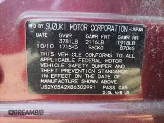 2011 Suzuki SX4 LE with VIN JS2YC5A2XB6302991, listed as a Copart auction lot 68815864 with 82,464 mi miles and Salvage Title. Bid and sale history available at carsss.com. Image 12.