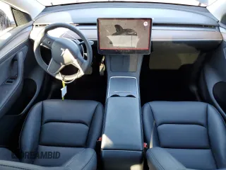 2024 Tesla Model Y with VIN 7SAYGDED3RF151031, listed as a Copart auction lot 49494165 with 7,503 mi miles and Salvage Title. Bid and sale history available at DreamBid. Image 8.
