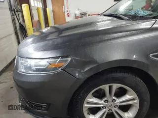 2015 Ford Taurus SEL with VIN 1FAHP2E87FG207029, listed as a IAAI auction lot 41752890 with 119,858 mi miles and . Bid and sale history available at carsss.com. Image 6.