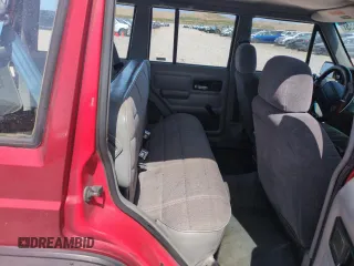 1996 Jeep Cherokee Sport with VIN 1J4FJ68S6TL171056, listed as a Copart auction lot 52099555 with 250,089 mi miles and Salvage Title. Bid and sale history available at carsss.com. Image 10.