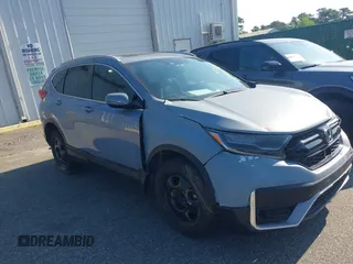 2021 Honda CR-V Touring with VIN 2HKRW2H90MH680172, listed as a IAAI auction lot 42422712 with 26,619 mi miles and . Bid and sale history available at DreamBid. Image 1.