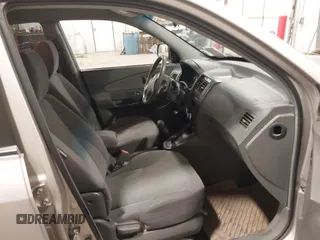 2006 Hyundai Tucson GL with VIN KM8JM12BX6U250937, listed as a IAAI auction lot 41529567 with 165,528 mi miles. Bid and sale history available at carsss.com. Image 5.