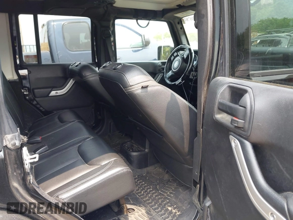 2015 Jeep Wrangler Unlimited Sahara with VIN 1C4HJWEG3FL661568, listed as a IAAI auction lot 42387810 with 140,927 mi miles and . Bid and sale history available at DreamBid. Image 8.