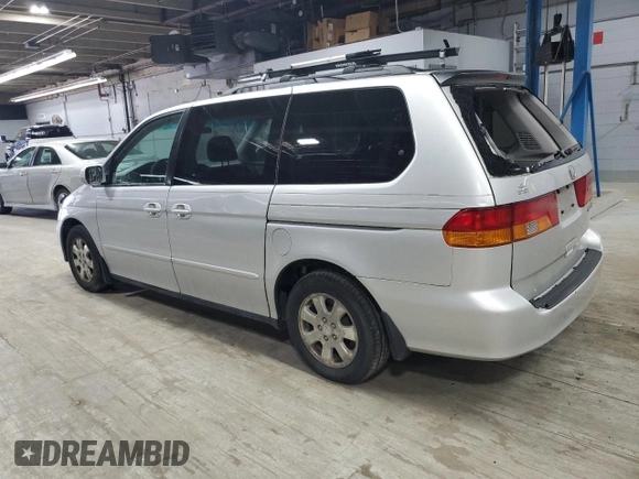 2002 Honda Odyssey EX with VIN 2HKRL18642H578718, listed as a Copart auction lot 59052525 with 170,928 mi miles and Salvage title. Bid and sale history available at DreamBid. Image 2.