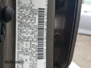 2013 Toyota Tacoma with VIN 3TMLU4EN5DM106850, listed as a Copart auction lot 61771865 with 153,507 mi miles and Salvage title. Bid and sale history available at DreamBid. Image 12.