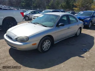 1999 Mercury Sable GS with VIN 1MEFM50U0XG609913, listed as a IAAI auction lot 41783308 with 80,022 mi miles. Bid and sale history available at carsss.com. Image 2.